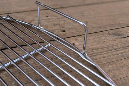 Designed to match the width of the Slow 'N Sear® XL, the single opening streamlines grate functionality while making it easier to access fuel in the basket. Two-zone cooking enthusiasts and Cold Grate Technique lovers rejoice! Made from high quality 304 stainless steel, this grate will simplify and elevate any cook.  | SnS Grills